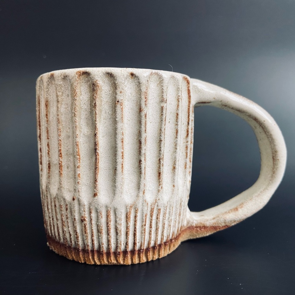 Beautiful carved stoneware mug - pottery clay